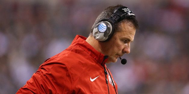 INDIANAPOLIS, IN - DECEMBER 07: Head coach Urban Meyer of the Ohio State Buckeyes looks down during the Big Ten Conference Championship game against the Michigan State Spartans at Lucas Oil Stadium on December 7, 2013 in Indianapolis, Indiana. (Photo by Andy Lyons/Getty Images)