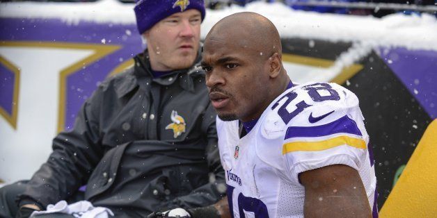 Minnesota Vikings running back Adrian Peterson leaves the field on a cart after suffering an injury during the first half of their game in Baltimore on Sunday, Dec. 8, 2013. (Doug Kapustin/MCT via Getty Images)
