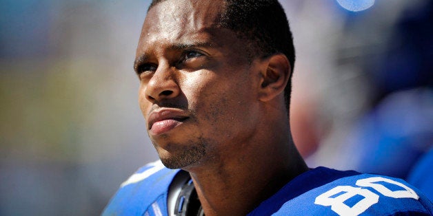 CHARLOTTE, NC - SEPTEMBER 22: Wide receiver Victor Cruz #80 of the New York Giants looks on during a NFL game against the Car