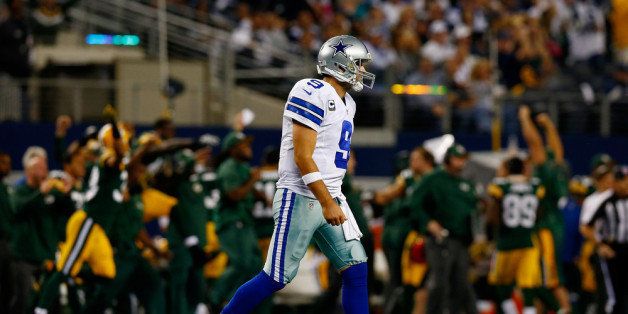 ARLINGTON, TX - DECEMBER 15: Quarterback Tony Romo #9 of the Dallas Cowboys walks off the field after losing 37-36 to the Green Bay Packers during a game at AT&T Stadium on December 15, 2013 in Arlington, Texas. (Photo by Tom Pennington/Getty Images)