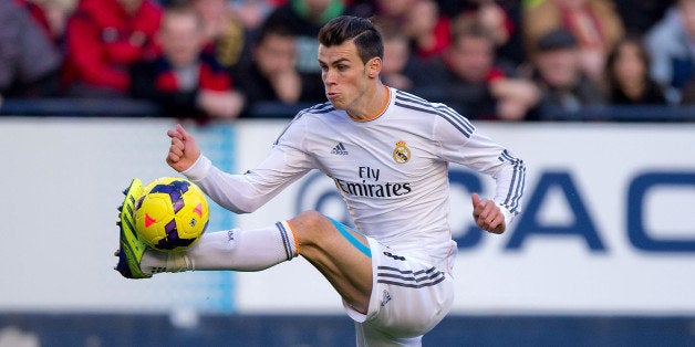 PAMPLONA, SPAIN - DECEMBER 14: Gareth Bale of Real Madrid CF controls the ball during the La Liga match between CA Osasuna and Real Madrid CF at Estadio El Sadar de Navarra on December 14, 2013 in Pamplona, Spain. (Photo by Gonzalo Arroyo Moreno/Getty Images)