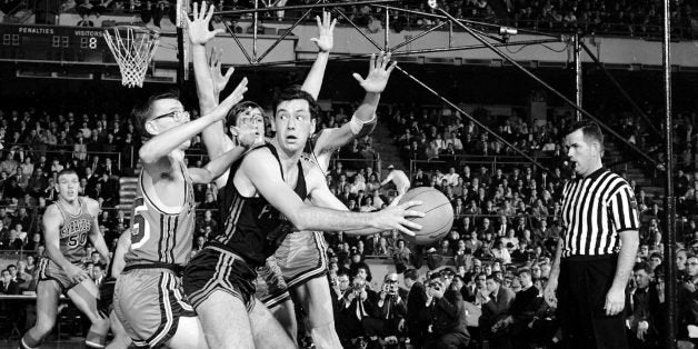 UNITED STATES - DECEMBER 28: Bill Bradley (r.) of Princeton is guarded by Syracuse's Jim Boeheim (l.) and Frank Nicoletti (head visible in rear) in first half of game in 13th Holiday Basketball Festival at Madison Square Garden. Tigers' win marked first time an Ivy League entry ever had survived first round of the festival. Bradley's 36 points advanced Princeton to semi-finals with the Michigan Wolverines. (Photo by John Duprey/NY Daily News Archive via Getty Images)