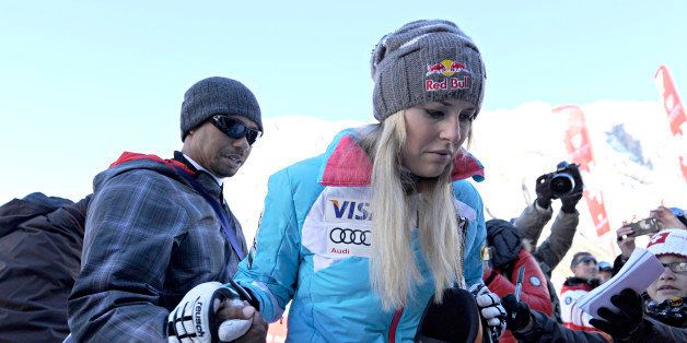 VAL D'ISERE, FRANCE - DECEMBER 21: (FRANCE OUT) Tiger Woods and Lindsey Vonn of USA during the Audi FIS Alpine Ski World Cup Women's Downhill on December 21, 2013 in Val d'Isere, France. (Photo by Michel Cottin/Agence Zoom/Getty Images)