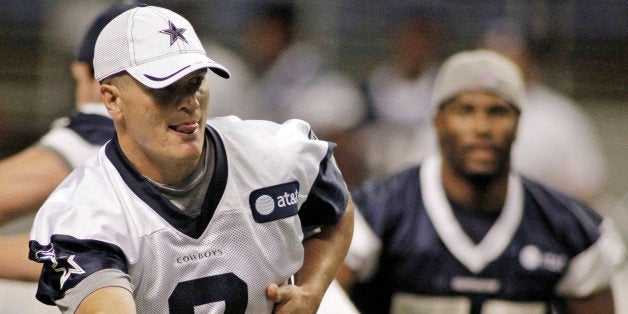 Dallas Cowboys quarterback Jon Kitna makes a handoff during training camp at the Alamo Dome in San Antonio, Texas, Saturday, July 30, 2011. (Paul Moseley/Fort Worth Star-Telegram/MCT via Getty Images)