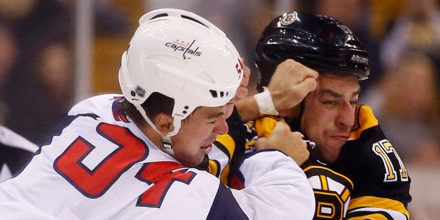 BOSTON, MA - SEPTEMBER 23: Milan Lucic #17 of the Boston Bruins fights Joel Rechlicz #54 of the Washington Capitals in the first period during the preseason game on September 23, 2013 at TD Garden in Boston, Massachusetts. (Photo by Jared Wickerham/Getty Images)