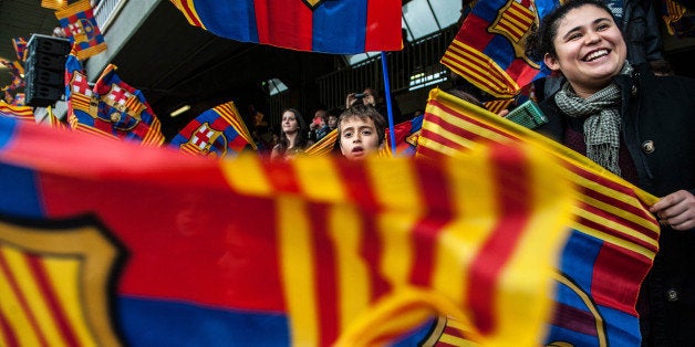 BARCELONA, SPAIN - JANUARY 03: FC Barcelona fans cheer up his team during a training session at the Mini Stadi Stadium on January 3, 2014 in Barcelona, Spain. (Photo by David Ramos/Getty Images)