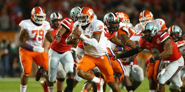 MIAMI GARDENS, FL - JANUARY 03: Tajh Boyd #10 of the Clemson Tigers runs for a touchdown in the first half against the Ohio State Buckeyes during the Discover Orange Bowl at Sun Life Stadium on January 3, 2014 in Miami Gardens, Florida. (Photo by Streeter Lecka/Getty Images)