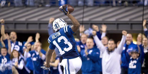 Indianapolis Colts wide receiver T.Y. Hilton (13) celebrates after scoring on a 65-yard touchdown reception against the Kansas City Chiefs in the fourth quarter of an AFC Wild Card Game at the Lucas Oil Stadium in Indianapolis, Ind., Saturday, Jan. 4, 2014. The Colts beat the Chiefs, 45-44. (John Sleezer/Kansas City Star/MCT via Getty Images)