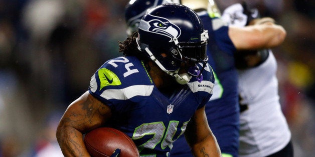 SEATTLE, WA - DECEMBER 02: Running back Marshawn Lynch #24 of the Seattle Seahawks carries the ball against the New Orleans Saints during a game at CenturyLink Field on December 2, 2013 in Seattle, Washington. (Photo by Jonathan Ferrey/Getty Images)