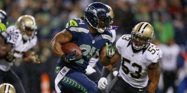 SEATTLE, WA - DECEMBER 02: Running back Marshawn Lynch #24 of the Seattle Seahawks rushes against the New Orleans Saints at CenturyLink Field on December 2, 2013 in Seattle, Washington. (Photo by Otto Greule Jr/Getty Images)