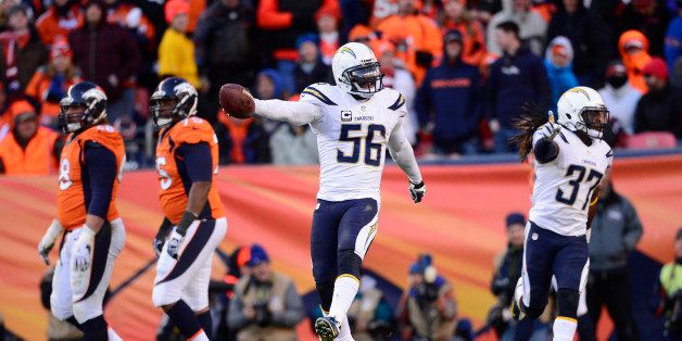 DENVER, CO - JANUARY 12: San Diego Chargers inside linebacker Donald Butler (56) celebrates after intercepting a pass in the end zone. The Denver Broncos take on the San Diego Chargers at Sports Authority Field at Mile High in Denver on January 12, 2014. (Photo by AAron Ontiveroz/The Denver Post via Getty Images)