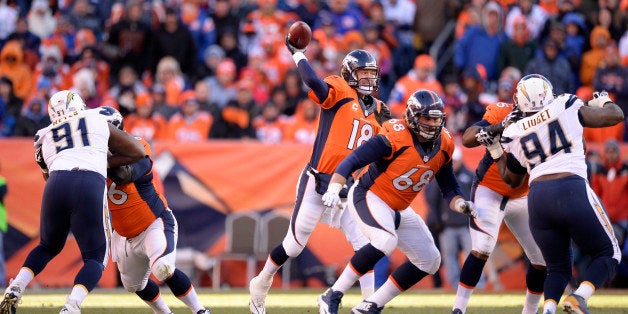 DENVER, CO - JANUARY 12: Denver Broncos quarterback Peyton Manning (18) throws during the second quarter. The Denver Broncos vs. The San Diego Chargers in an AFC Divisional Playoff game at Sports Authority Field at Mile High in Denver on January 12, 2014. (Photo by John Leyba/The Denver Post via Getty Images)