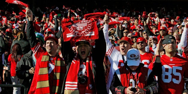 SAN FRANCISCO, CA - DECEMBER 08: San Francisco 49ers fans cheer on their team at the start of the last day game in Candlesti