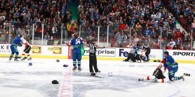 VANCOUVER, BC - JANUARY 18: A line brawl between the Vancouver Canucks and the Calgary Flames broke out at the start of the