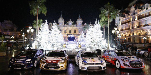 (From L) Finland driver Mikko Hirvonen's Ford Fiesta R, British driver Kris Meeke's Cirtoen DS3, French Sebastien Ogier's Volkswagen Polo R, and Belgium Thierry Neuville's Hyundai I20 are presented during the opening ceremony of the 82nd Monte-Carlo Rally, the opening race of the 2014 World Rally Championship, on January 13, 2014 in Monaco. AFP PHOTO / VALERY HACHE (Photo credit should read VALERY HACHE/AFP/Getty Images)