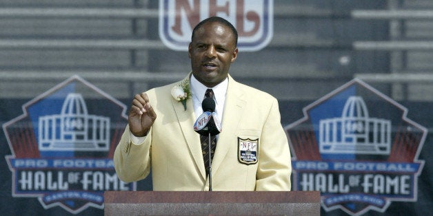 UNITED STATES - AUGUST 05: Warren Moon, the first African American quarterback to be inducted into the hall of fame, speaks during his induction into the Pro Football Hall of Fame on Saturday, August 5, 2006, in Canton, Ohio. Quarterback Troy Aikman, a member of three Super Bowl championship teams, and the late Reggie White, who's second in National Football League history with 198 career sacks, were inducted into the Pro Football Hall of Fame. Quarterback Warren Moon, linebacker Harry Carson, lineman Rayfield Wright and former coach John Madden were also enshrined during ceremonies at Fawcett Stadium in Canton, Ohio. (Photo by Jay Laprete/Bloomberg via Getty Images)