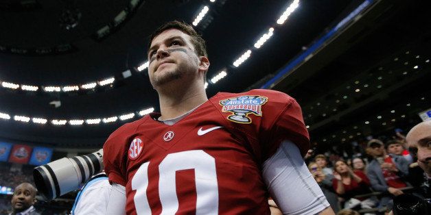 NEW ORLEANS, LA - JANUARY 02: AJ McCarron #10 of the Alabama Crimson Tide walks off the field after the Allstate Sugar Bowl at the Mercedes-Benz Superdome on January 2, 2014 in New Orleans, Louisiana. The Sooners defeated the Crimson Tide 45-31. (Photo by Kevin C. Cox/Getty Images)