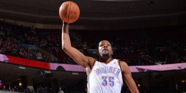 PHILADELPHIA, PA - JANUARY 25: Kevin Durant #35 of the Oklahoma City Thunder going up for a dunk during a game against the Philadelphia 76ers at the Wells Fargo Center on January 25, 2014 in Philadelphia, Pennsylvania. NOTE TO USER: User expressly acknowledges and agrees that, by downloading and or using this photograph, User is consenting to the terms and conditions of the Getty Images License Agreement. Mandatory Copyright Notice: Copyright 2014 NBAE (Photo by Jesse D. Garrabrant/NBAE via Getty Images)
