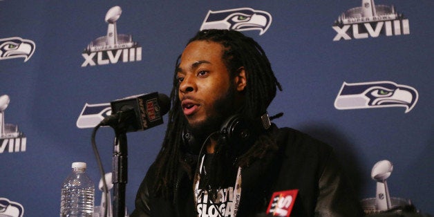 JERSEY CITY, NJ - JANUARY 26: Richard Sherman of the Seattle Seahawks addresses the media at the Westin Hotel on January 26, 2014 in Jersey City, New Jersey. (Photo by Elsa/Getty Images)