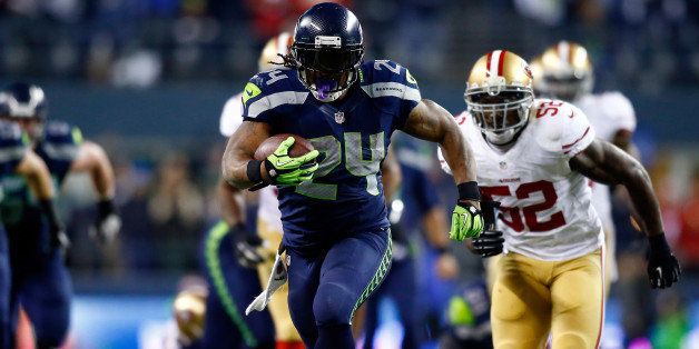SEATTLE, WA - JANUARY 19: Running back Marshawn Lynch #24 of the Seattle Seahawks carries the ball against the San Francisco 49ers during the 2014 NFC Championship at CenturyLink Field on January 19, 2014 in Seattle, Washington. (Photo by Jonathan Ferrey/Getty Images) 