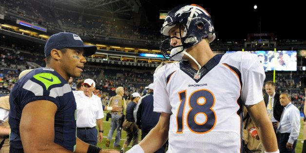 SEATTLE, WA. - AUGUST 17: Denver Broncos quarterback Peyton Manning (18) shakes hands with Seattle Seahawks quarterback Russell Wilson (3) after the game August 17, 2013 at Century Link Field. (Photo By John Leyba/The Denver Post via Getty Images)