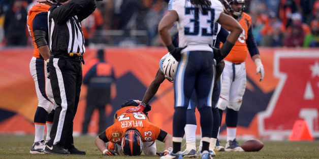 DENVER, CO - DECEMBER 08: Denver Broncos wide receiver Wes Welker (83) lays on the field after getting a concussion in the second quarter. The Denver Broncos take on the Tennessee Titans at Sports Authority Field at Mile High in Denver on December 8, 2013. (Photo by John Leyba/The Denver Post via Getty Images)