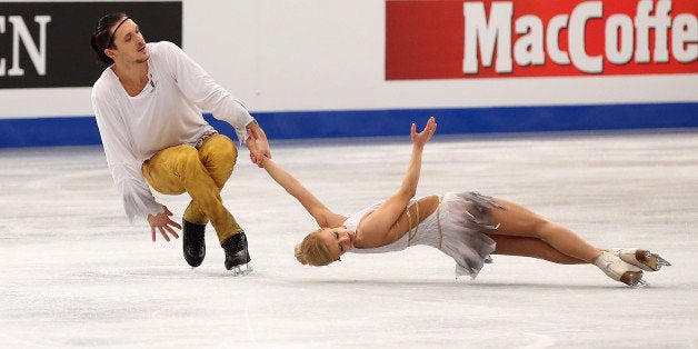 BUDAPEST, HUNGARY - JANUARY 19: Tatiana Volosozhar and Maxim Trankov of Russia (center) win the gold medal in the Pairs Skati