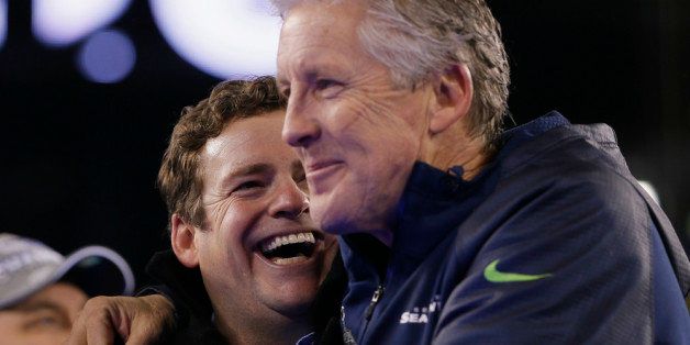 EAST RUTHERFORD, NJ - FEBRUARY 02: (L-R) John Schneider, General Manager of the Seattle Seahawks and head coach Pete Carroll celebrates after their 43-8 victory over the Denver Broncos during Super Bowl XLVIII at MetLife Stadium on February 2, 2014 in East Rutherford, New Jersey. (Photo by Kevin C. Cox/Getty Images)