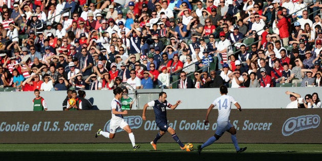 LOS ANGELES, CA - FEBRUARY 01: Landon Donovan #10 of the USA paces the ball on the attack against Kim Kee-Hee #16 and Lee Yong #14 of the Korea Republic in the second half of thei international friendly match at StubHub Center on February 1, 2014 in Los Angeles, California. The USA defeated the Korea Republic 2-0. (Photo by Victor Decolongon/Getty Images)