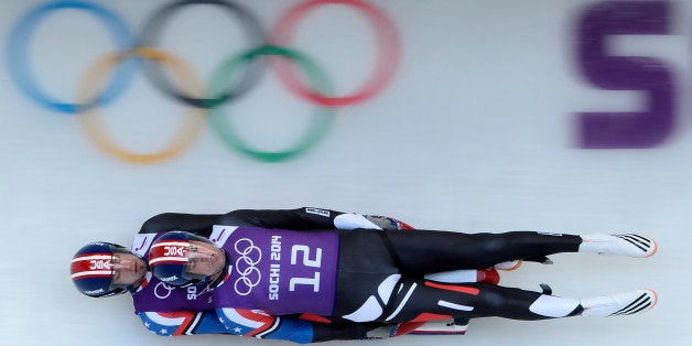 US Christian Niccum and Jayson Terdiman take part in the training run 4 of the luge doubles during the 2014 Sochi Winter Olympics at the Sanki Sliding Center in Rosa Khutor on February 10, 2014. AFP PHOTO / LIONEL BONAVENTURE (Photo credit should read LIONEL BONAVENTURE/AFP/Getty Images)