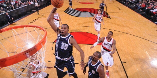 PORTLAND, OR - FEBRUARY 11: Kevin Durant #35 of the Oklahoma City Thunder dunks against the Portland Trail Blazers on February 11, 2014 at the Moda Center Arena in Portland, Oregon. NOTE TO USER: User expressly acknowledges and agrees that, by downloading and or using this photograph, user is consenting to the terms and conditions of the Getty Images License Agreement. Mandatory Copyright Notice: Copyright 2014 NBAE (Photo by Sam Forencich/NBAE via Getty Images)