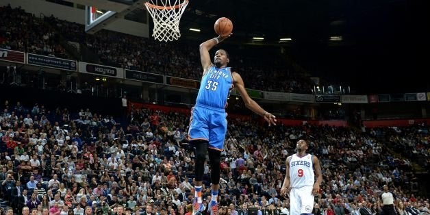 Oklahoma City Thunder's Kevin Durant dunks the ball against the Philadelphia 76ers, during the NBA Global Games at the Phones4 u Arena, Manchester.