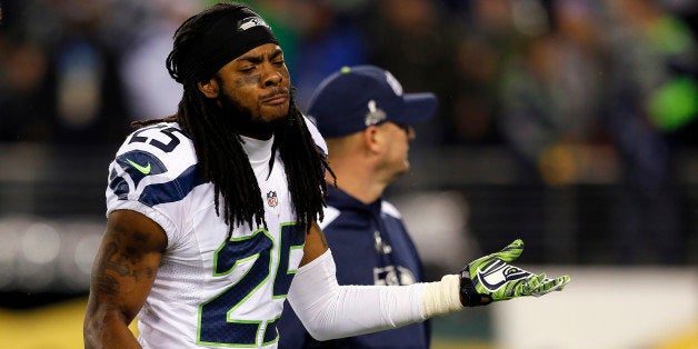 EAST RUTHERFORD, NJ - FEBRUARY 02: Cornerback Richard Sherman #25 of the Seattle Seahawks walks off the field at the end of