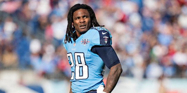 NASHVILLE, TN - DECEMBER 29: Chris Johnson #28 of the Tennessee Titans watches a replay during a game against the Houston Texans at LP Field on December 29, 2013 in Nashville, Tennessee. The Titans defeated the Texans 16-10. (Photo by Wesley Hitt/Getty Images)