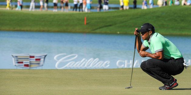 DORAL, FL - MARCH 8: Tiger Woods lines up a putt on the 18th green during the third round of the World Golf Championships-Cadillac Championship at Blue Monster, Trump National Doral, on March 8, 2014 in Doral, Florida. (Photo by Stan Badz/PGA TOUR)