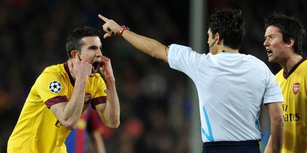 BARCELONA, SPAIN - MARCH 08: Robin van Persie (L) of Arsenal reacts to referee Massimo Busacca after receiving a red card during the UEFA Champions League round of 16 second leg match between Barcelona and Arsenal on March 8, 2011 in Barcelona, Spain. (Photo by Jasper Juinen/Getty Images)