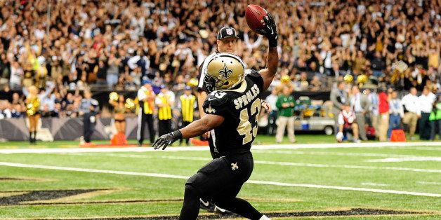 NEW ORLEANS, LA - NOVEMBER 10: Darren Sproles #43 of the New Orleans Saints celebrates a touchdown during a game against the Dallas Cowboys at the Mercedes-Benz Superdome on November 10, 2013 in New Orleans, Louisiana. New Orleans won the game 49-17. (Photo by Stacy Revere/Getty Images)