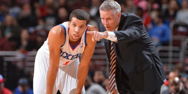 PHILADELPHIA, PA - MARCH 12: Brett Brown of the Philadelphia 76ers talks with Michael Carter-Williams #1 during the game against the Sacramento Kings at the Wells Fargo Center on March 12, 2014 in Philadelphia, Pennsylvania. NOTE TO USER: User expressly acknowledges and agrees that, by downloading and or using this photograph, User is consenting to the terms and conditions of the Getty Images License Agreement. Mandatory Copyright Notice: Copyright 2014 NBAE (Photo by Jesse D. Garrabrant/NBAE via Getty Images)