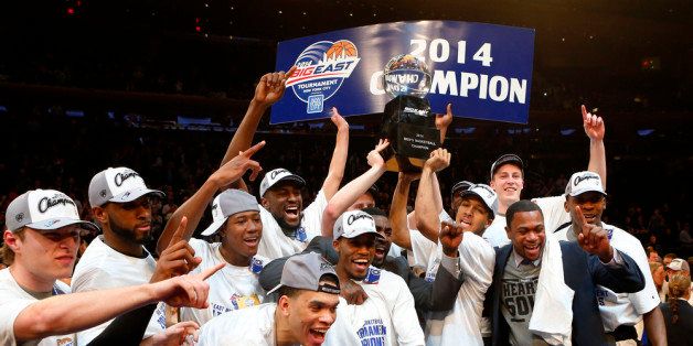 NEW YORK, NY - MARCH 15: The Providence Friars celebrate with the trophy after defeating the Creighton Bluejays 65 to 58 to win the Championship game of the 2014 Men's Big East Basketball Tournament at Madison Square Garden on March 15, 2014 in New York City. (Photo by Jim McIsaac/Getty Images)