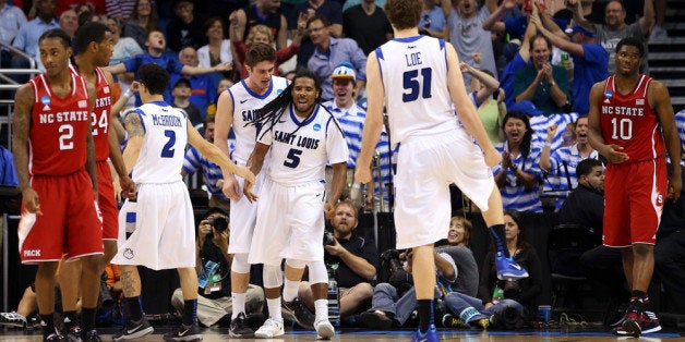 ORLANDO, FL - MARCH 20: Jordair Jett #5 of the Saint Louis Billikens celebrates a basket in the second half to tie the game against the North Carolina State Wolfpack during the second round of the 2014 NCAA Men's Basketball Tournament at Amway Center on March 20, 2014 in Orlando, Florida. (Photo by Mike Ehrmann/Getty Images)