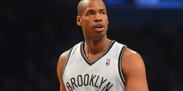 BROOKLYN, NY - MARCH 10: Jason Collins #98 of the Brooklyn Nets during a game against the Toronto Raptors on March 10, 2014 at the Barclays Center in Brooklyn, New York. NOTE TO USER: User expressly acknowledges and agrees that, by downloading and or using this photograph, User is consenting to the terms and conditions of the Getty Images License Agreement. Mandatory Copyright Notice: Copyright 2014 NBAE (Photo by Jesse D. Garrabrant/NBAE via Getty Images)