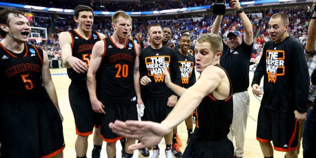 RALEIGH, NC - MARCH 21: Kevin Canevari #3 of the Mercer Bears celebrates with teammates after defeating the Duke Blue Devils