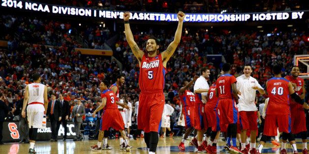 BUFFALO, NY - MARCH 22: Devin Oliver #5 of the Dayton Flyers reacts after defeating the Syracuse Orange 55-53 in the third round of the 2014 NCAA Men's Basketball Tournament at the First Niagara Center on March 22, 2014 in Buffalo, New York. (Photo by Elsa/Getty Images)