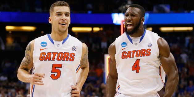 ORLANDO, FL - MARCH 22: Scottie Wilbekin #5 and Patric Young #4 of the Florida Gators celebrate after Wilbekin makes a three-pointer to end the first half against the Pittsburgh Panthers during the third round of the 2014 NCAA Men's Basketball Tournament at Amway Center on March 22, 2014 in Orlando, Florida. (Photo by Kevin C. Cox/Getty Images)