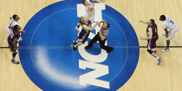 SAN DIEGO, CA - MARCH 23: Jacob Parker #34 of the Stephen F. Austin Lumberjacks tips-off against Travis Wear #24 of the UCLA Bruins to start their game during the third round of the 2014 NCAA Men's Basketball Tournament at Viejas Arena on March 23, 2014 in San Diego, California. (Photo by Jeff Gross/Getty Images)