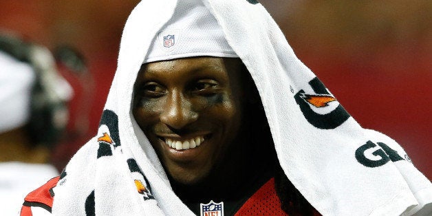 ATLANTA, GA - AUGUST 08: Roddy White #84 of the Atlanta Falcons enjoys a laugh on the sidelines during the game against the Cincinnati Bengals at Georgia Dome on August 8, 2013 in Atlanta, Georgia. (Photo by Kevin C. Cox/Getty Images)