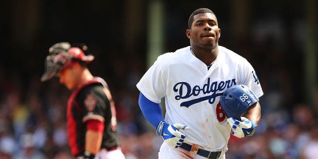 SYDNEY, AUSTRALIA - MARCH 23: Yasiel Puig of the Dodgers runs back to the dugout after being caught during the MLB match between the Los Angeles Dodgers and the Arizona Diamondbacks at Sydney Cricket Ground on March 23, 2014 in Sydney, Australia. (Photo by Brendon Thorne/MLB Photos via Getty Images)