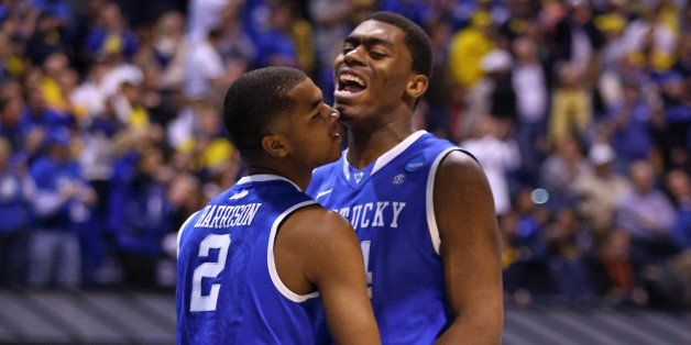 INDIANAPOLIS, IN - MARCH 30: Dakari Johnson #44 of the Kentucky Wildcats celebrates with teammate Aaron Harrison #2 after a two point play and the foul in the second half against the Michigan Wolverines during the midwest regional final of the 2014 NCAA Men's Basketball Tournament at Lucas Oil Stadium on March 30, 2014 in Indianapolis, Indiana. (Photo by Andy Lyons/Getty Images)