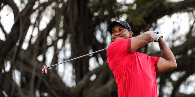 DORAL, FL - MARCH 9: Tiger Woods tees off on the fifth hole during the final round of the World Golf Championships-Cadillac Championship at Blue Monster, Trump National Doral, on March 9, 2014 in Doral, Florida. (Photo by Stan Badz/PGA TOUR)