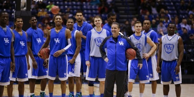 Kentucky Wildcats head coach John Calipari talks to his team as Kentucky practiced at Lucas Oil Stadium on Thursday March 27,